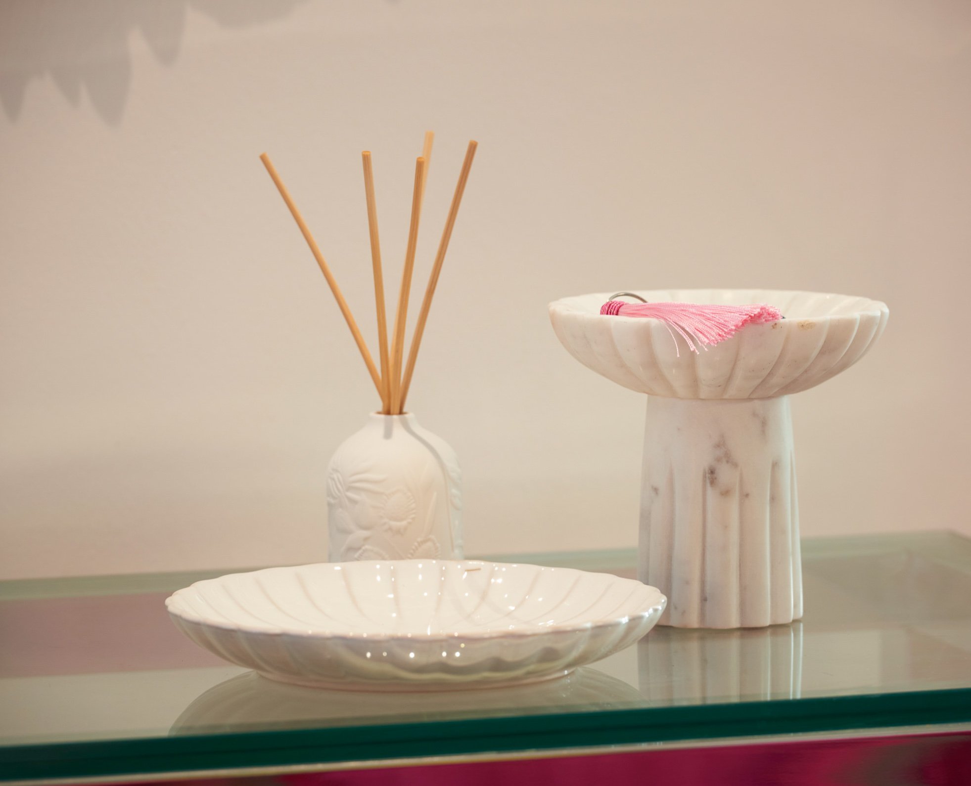 Reed diffuser and ceramics on the glass table