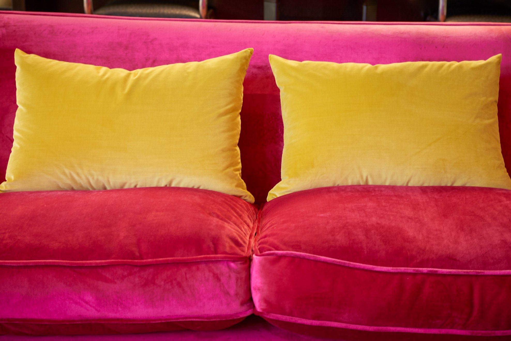Yellow cushions on pink velvet
