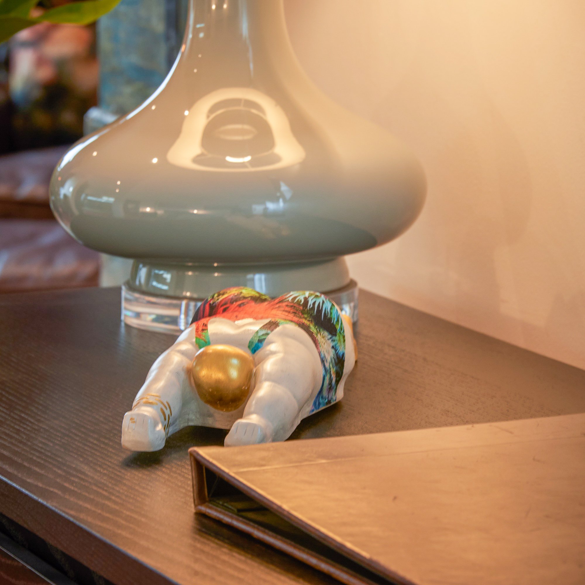 Ceramic lamp and figurine on the sideboard
