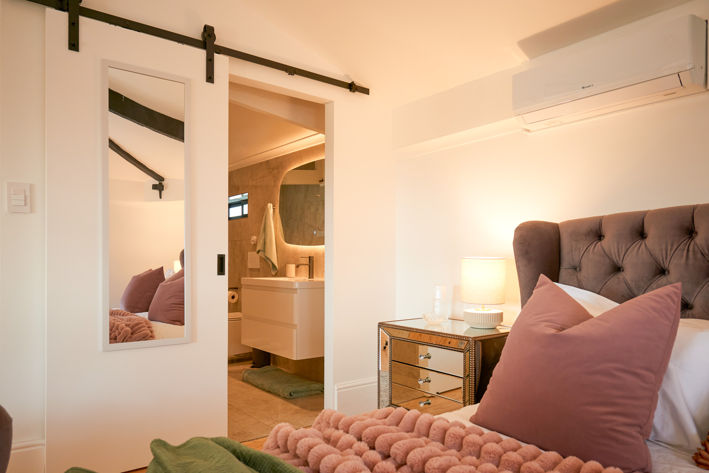 The Sage sleeping area, with the barn door through to the en-suite